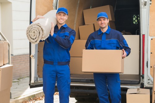 Man with van service loading items for a move in Millbank