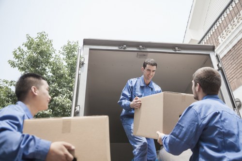 Removal team planning a move in a Millbank residential street