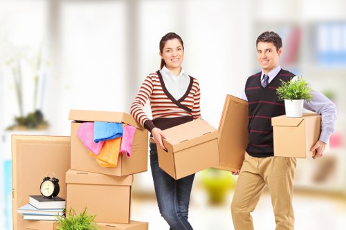 Packed moving boxes and furniture in a central London property