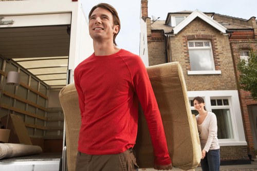 Local removalists loading household items for transport