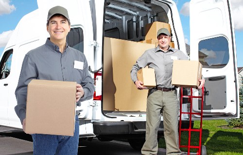 Careful unpacking service organizing boxes in a Millbank apartment